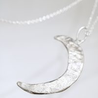 Silver Crescent Moon Spells Necklace