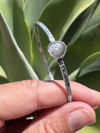 Grey moonstone symbolizes deep intuition, introspection and emotional protection. It helps one discover hidden truths and protects during transitions. It can enhance dreams and is known to be a gem for clairvoyants, bridging the gap between conscious and subconscious minds.